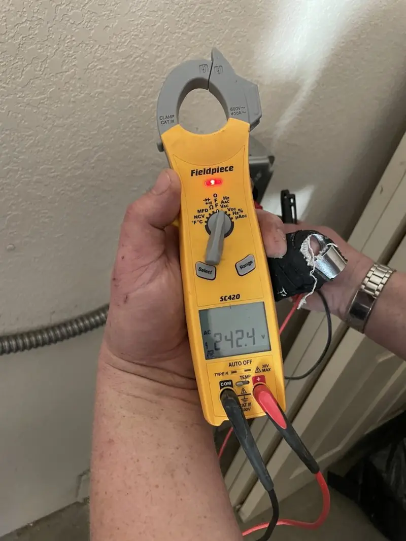Voltage testing with clamp meter during Outlet Installation in Pocomoke City